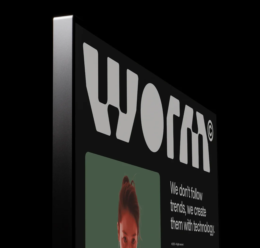 Worm wordmark on a dark screen, with the line “We don’t follow trends, we create them with technology”