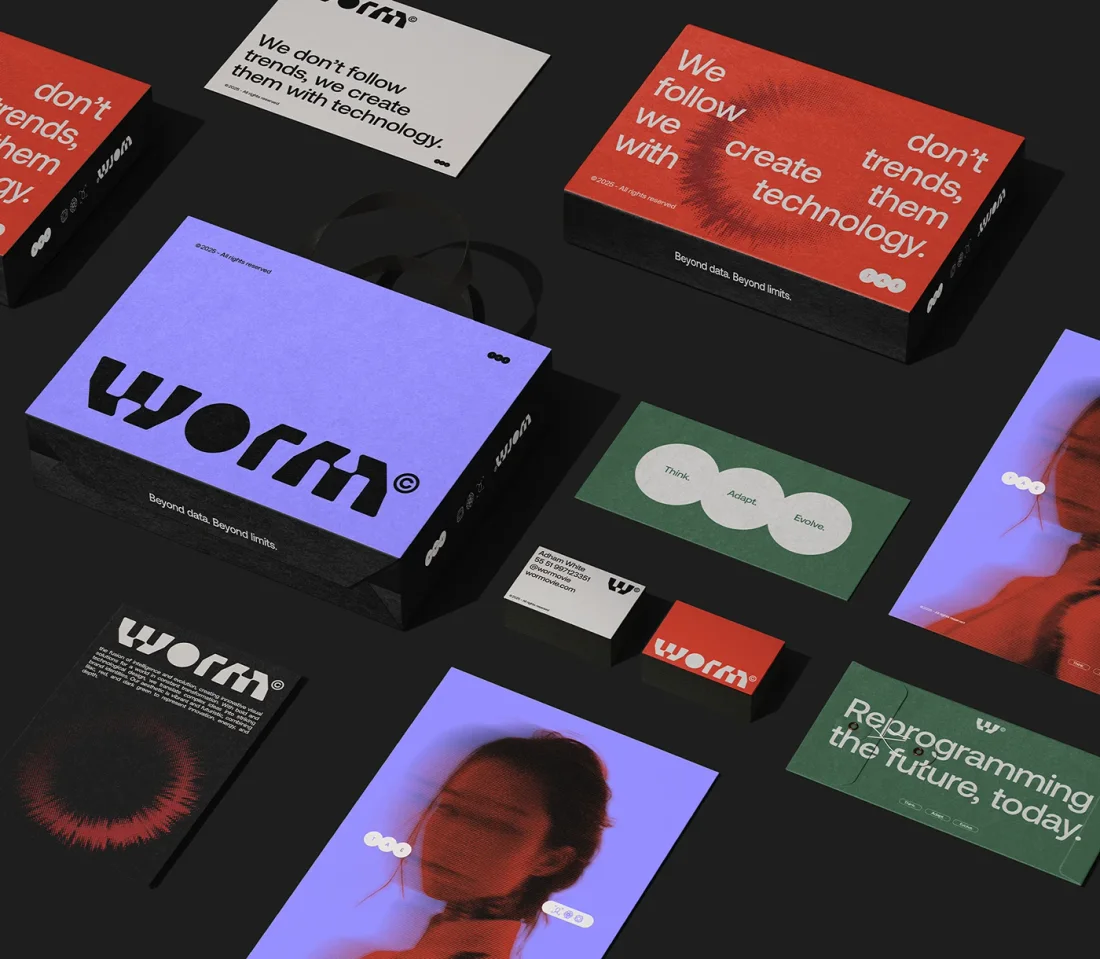 A hand holding a clear Worm card with the W symbol and “Beyond data. Beyond limits.” against red